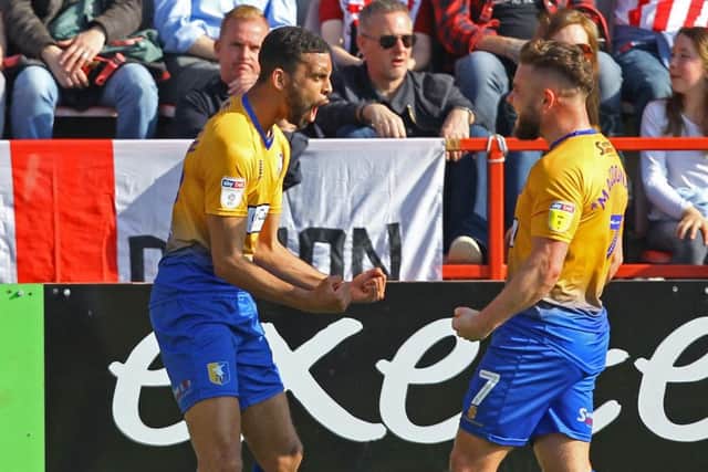 CJ Hamilton celebrates his second at Exeter, making it 2-1.