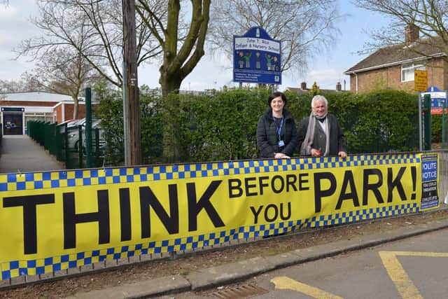 John T Rice Infant and Nursery School are erecting signs outside the school reminding people to park carefully, headteacher Shelley Bennett is pictured with Coun Sid Walker