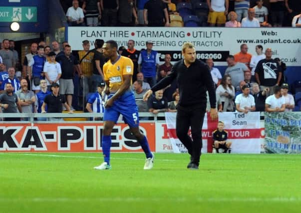 Mansfield Town v Sheffield Wednesday.
Krystian Pearce is led away from trouble at the end of the game.