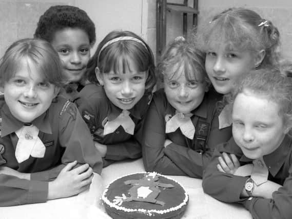 1989: These smiley Brownies from Skegby celebrate with cake at their 75th anniversary gala. Do you recognise anyone?