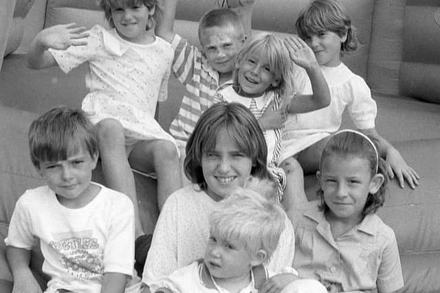 1990: These children are having loads of fun on the bouncy castle at the Blidworth Church garden party.  Are you on this picture?