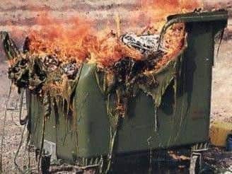 A bin on fire.