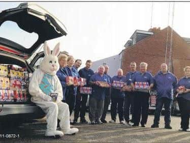 Drivers and other staff at Mansfield company 6Five2s Taxi prepare to set off on an Easter egg run to 10 schools
