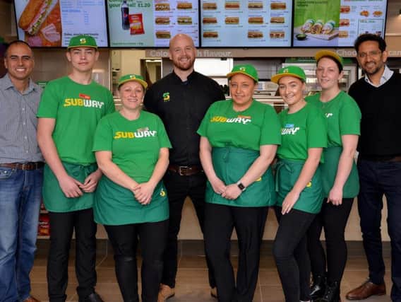 New Subway opened at Kirkby Precinct , the team are pictured with franchise owner Ama Mandeir and Subway business development agent Tesh Patel.