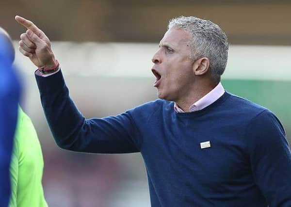 NORTHAMPTON, ENGLAND - MARCH 30: Northampton Town manager Keith Curle shouts instructions during the Sky Bet League Two match between Northampton Town and Port Vale at PTS Academy Stadium on March 30, 2019 in Northampton, United Kingdom. (Photo by Pete Norton/Getty Images)