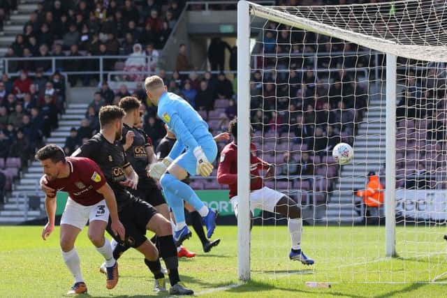 Mal Benning's corner for Mansfield evades everyone and finds the far corner of the net to make it 1-0 at Northampton.