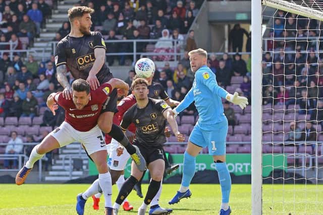 Mal Benning's corner deceives everyone including Northampton keeper David Cornell to make it 1-0 to the Stags.