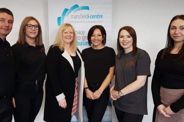 Adina Worboys (centre right) with members of her team and Sally Wharton, manager of the Mansfield i-Centre (centre left).