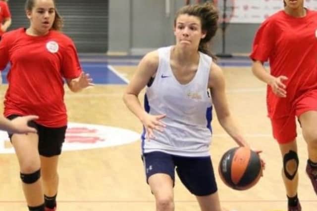 Megan Adair in action on the basketball court.