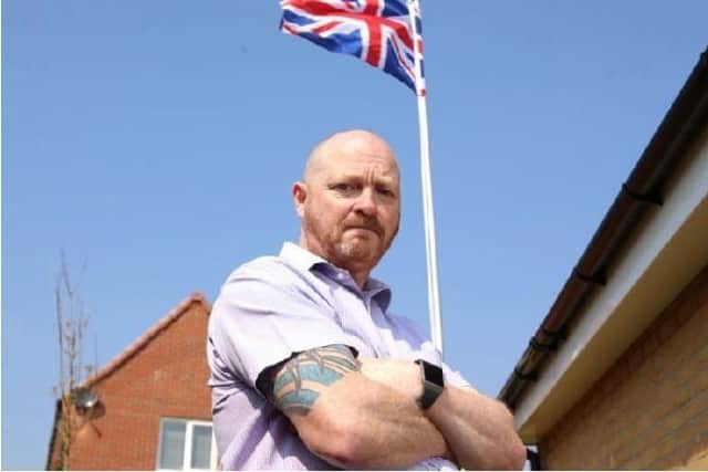 Andrew Smith installed the flag on a pole in tribute to Great Britain after serving six years in the Royal Signals.