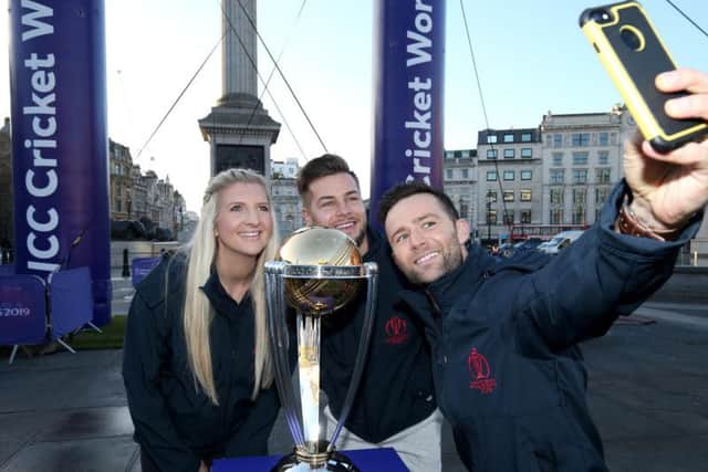 Chris Hughes, Becky Adlington and Harry Judd take a selfie photograph with the ICC Cricket World Cup Trophy as they celebrate 100 days-to-go to the Cricket World Cup in Trafalgar Square. (Photo by Jack Thomas/Getty Images for CWC19)