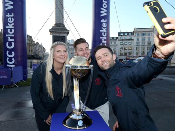 Chris Hughes, Becky Adlington and Harry Judd take a selfie photograph with the ICC Cricket World Cup Trophy as they celebrate 100 days-to-go to the Cricket World Cup in Trafalgar Square. (Photo by Jack Thomas/Getty Images for CWC19)