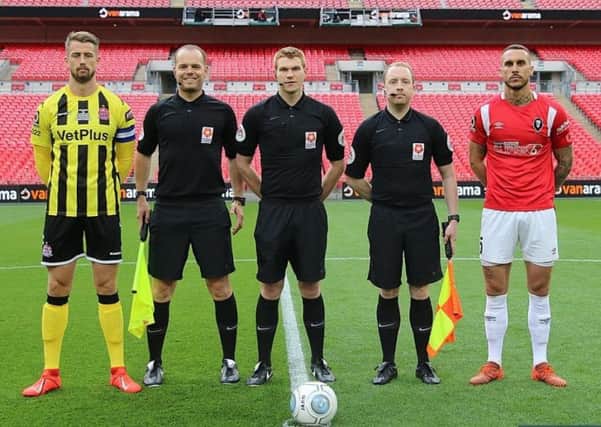 David Hunt (second left) with the other officials and the two team captains at Wembley on Saturday.