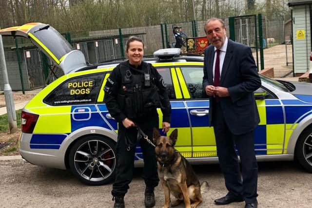 Paddy Tipping, PCC for Nottinghamshire, with police dog Quantum and his handler.