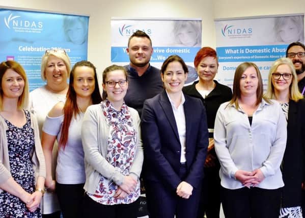 Mansfield MP Ben Bradley with Vicky Atkins MP, domestic abuse minister, and  staff at NIDAS
