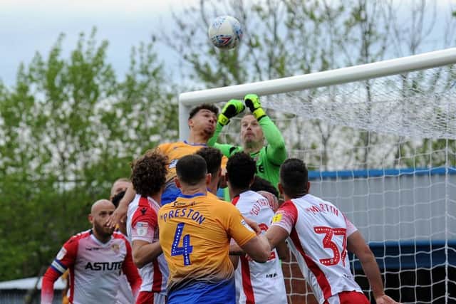 Tyler Walker puts pressure on a corner ball in the second half.