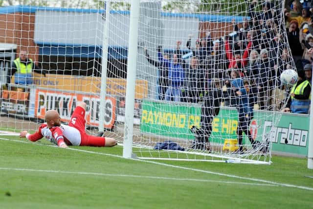 Tyler Walker's equaliser hits the back of the net.