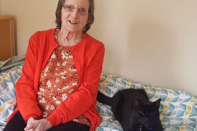 Beryl Barfield and her beloved cat, George.