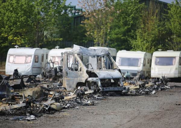 Numerous caravans and motorhomes that have been burnt out following a fire at a storage site in Blidworth, Nottinghamshire.  April 30, 2019.  See SWNS story SWMDblaze.  Emergency services were called out after the incident was reported around 2am, on Tuesday, April 30.  Nottinghamshire Fire and Rescue Service said as many as 70 caravans, motorhomes and horses boxes were destroyed by the flames, with a further 50 caravans damaged by the heat.  Six Nottinghamshire fire crews attended the scene for around five hours.  The incident happened at a site off the A614 in Blidworth, between Haywood Oaks and Baulker Lane.