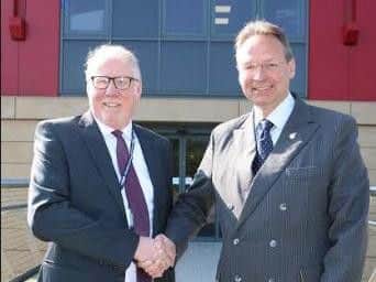 Chair of governors Sean Lyons (left) congratulates Andrew Cropley on his appointment.