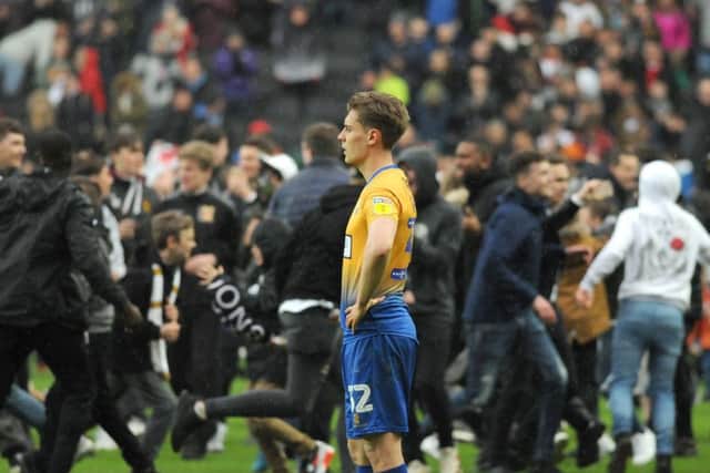Mansfield Town v Milton Keynes.
Danny Rose is isolated amid a sea of MK Dons fans at the final whistle.