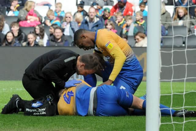 Mansfield Town v Milton Keynes.
Matt Preston gets some attention after a free kick.