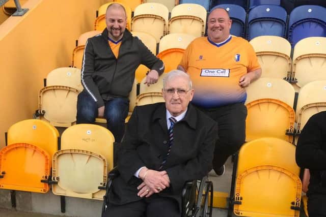 Derrick Newton front and two Stags fans at the match.