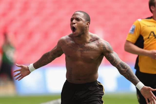 Aaron O'Connor of Newport County celebrates scoring a goal during the Blue Square Bet Premier Conference Play-off Final between Wrexham and Newport County A.F.C  at Wembley Stadium on May 5, 2013.
