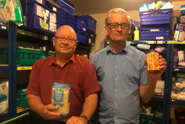 Volunteers Owen Asher and Glenn Parker.