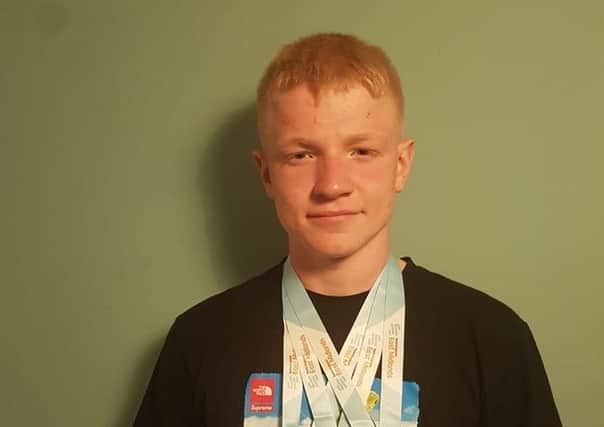 Tom Trueman with his medals.