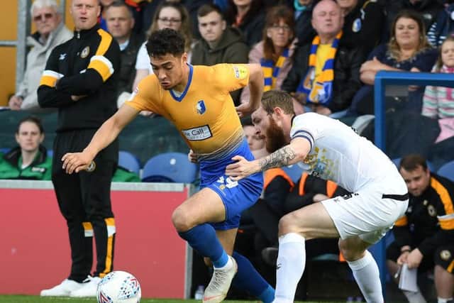 Tyler Walker takes on Mark O'Brien during the play-off semi-final.