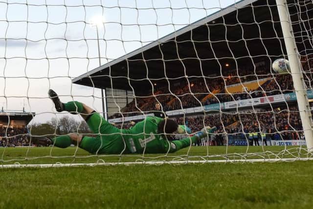 Mansfield's Tyler Walker has his penalty saved by Newport's keeper Joe Day - the only miss in the shoot-out.