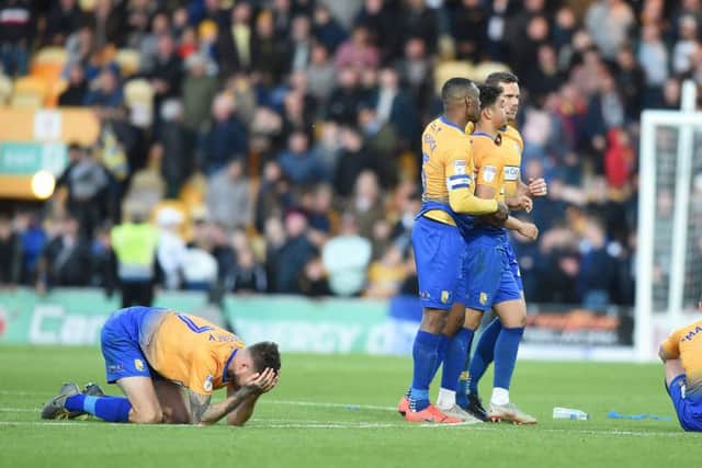 Tyler Walker is comforted by skipper Krystain Peace after his penalty miss cost the Stags a place at Wembley