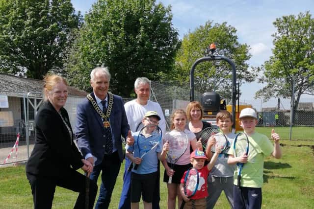 Councillor Joyce Bosnjak, Coun Kevin Rostance, and representatives and members of the tennis club at the official launch of the new clubhouse development.
