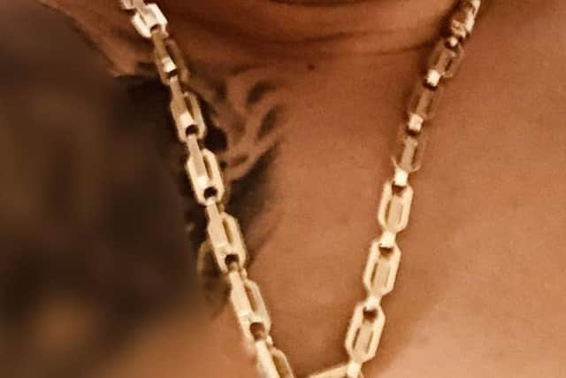 The man had this gold chain stolen from him.