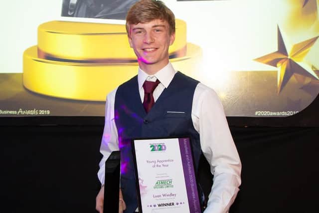 Luan Windley with his young apprentice of the year award.