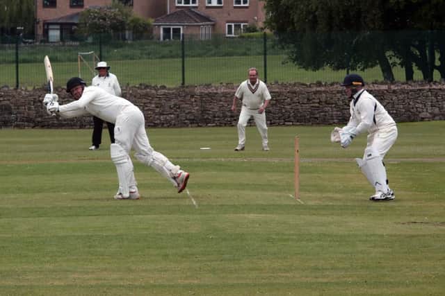 Mansfield HM batsman Stephen Gooding flicks Brandon Pritchard into the legside.