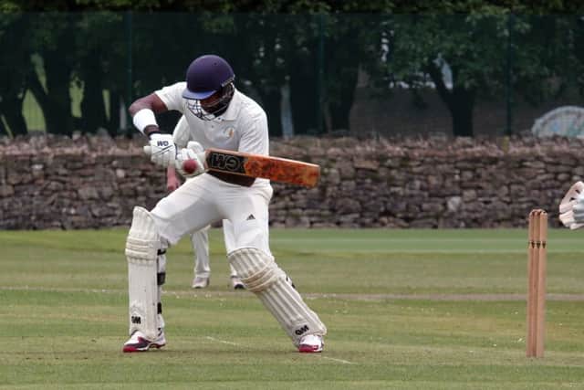 Mansfield HM batsman Anuk Fernanda waits and opens the face and glides Brandon Pritchard down to third man.