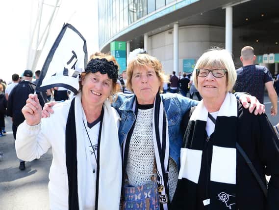 Derby County fans light up Wembley Way.