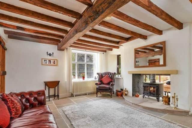 With feature fireplace and elegant beamed ceiling