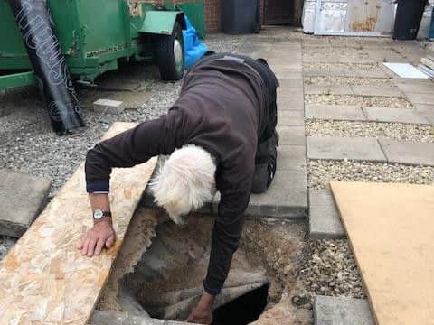 Barry Brown is worried about his property after a sinkhole opened up