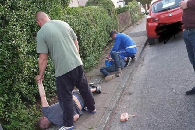 The two men, detained at the scene. Image: Shane Mills.