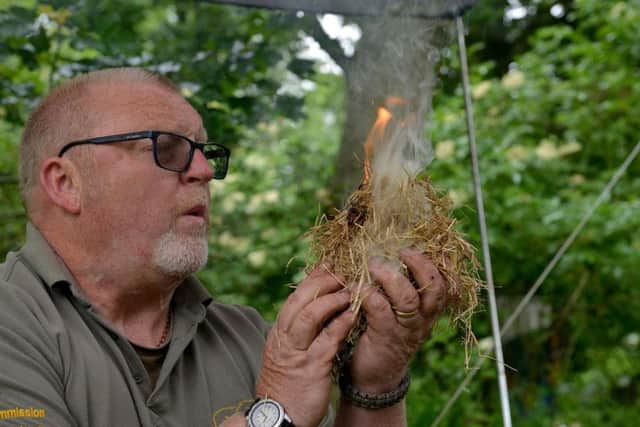 Bushcraft instructor Martin Rollin demonstrating how to make fire