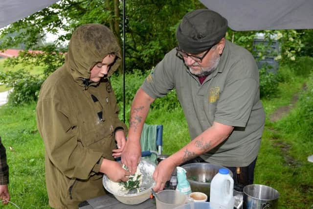 Kev Keane of Silverback Bushcraft making nettle bread with Casey Keane, 12