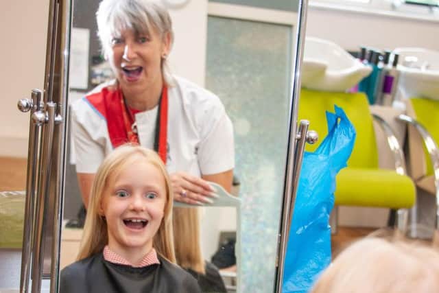 Chloe's first look at her new hair cut