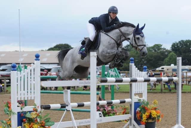 Beth Vernon and Pewit Dezoito on their way to victory. (PHOTO BY: British Showjumping)