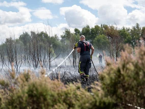 A Notts fireman at a grass fire.