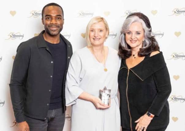 Group Consultant Sue Redfern, centre, with TV presenter Ore Oduba, left, and Slimming World founder Margaret Miles Bramwell.