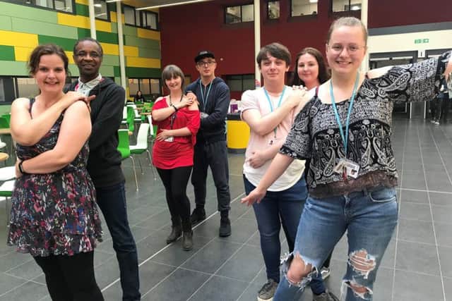Staff and students at West Nottinghamshire College perform an end-of-term 'flash mob' to a dance routine to raise awareness of mental health.