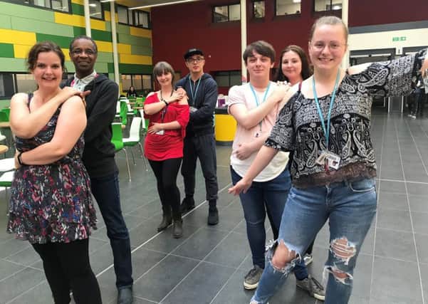 Staff and students at West Nottinghamshire College perform an end-of-term 'flash mob' to a dance routine to raise awareness of mental health.